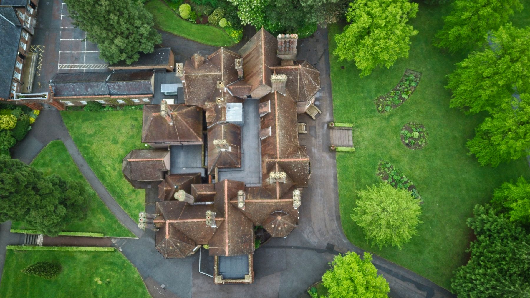 Top-down aerial reference photograph of a historic English property surrounded by gardens.
